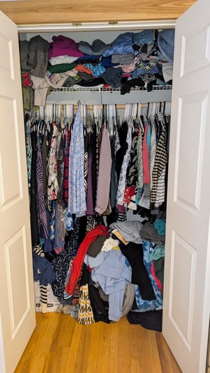 Very full closet from floor to ceiling